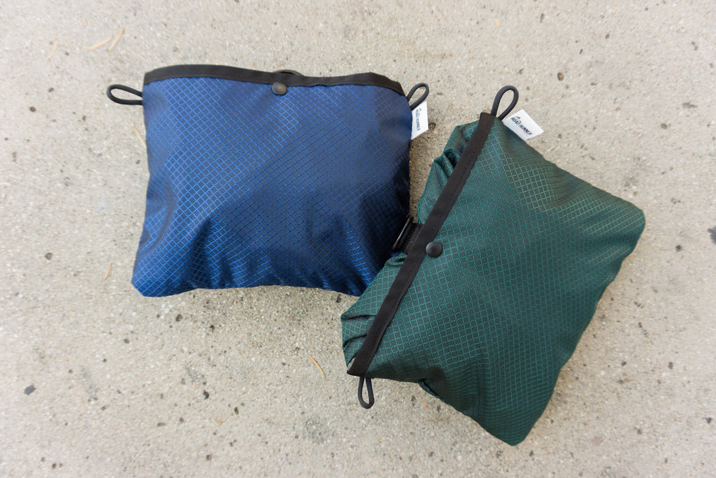Comrad Packable Backpack in Fir Green and Navy Packed
