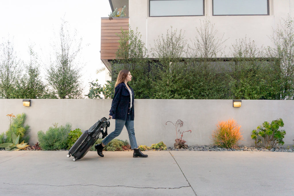 Everything Tote Bag in Grey Cordura being used as a travel bag.
