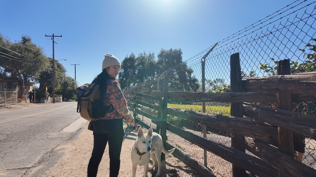 Slacker Backpack in Coyote walking the rural streets