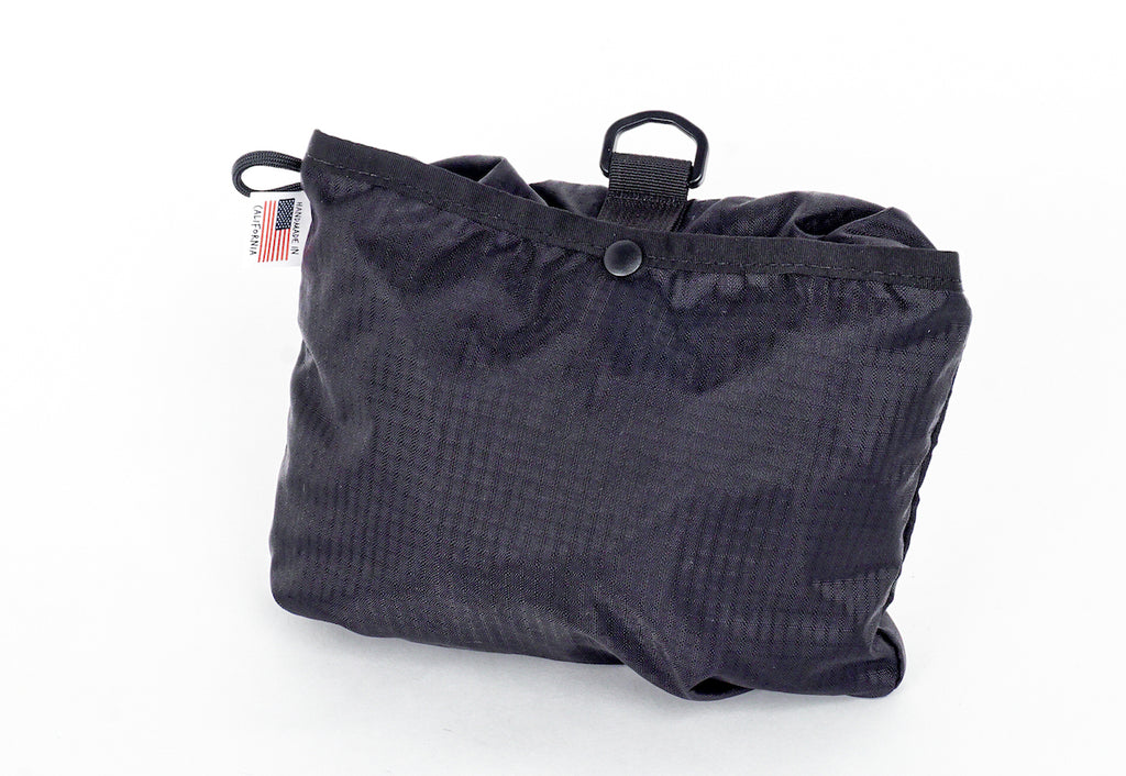 Comrad Packable Backpack Packed up in Black
